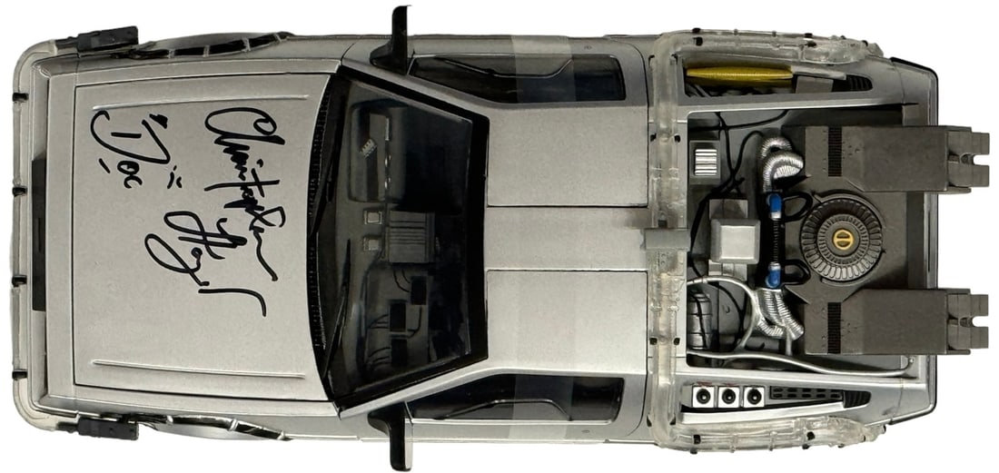 Christopher Lloyd Signed Back to the Future DeLorean Time Machine 1: 15 Scale Die: Christopher Lloyd Signed Back to the Future DeLorean Time Machine 1: 15 Scale Die Signed by Christopher Lloyd in black sharpie on the hood of the 1:15 scale die cast DeLorean Time Machine, this detail