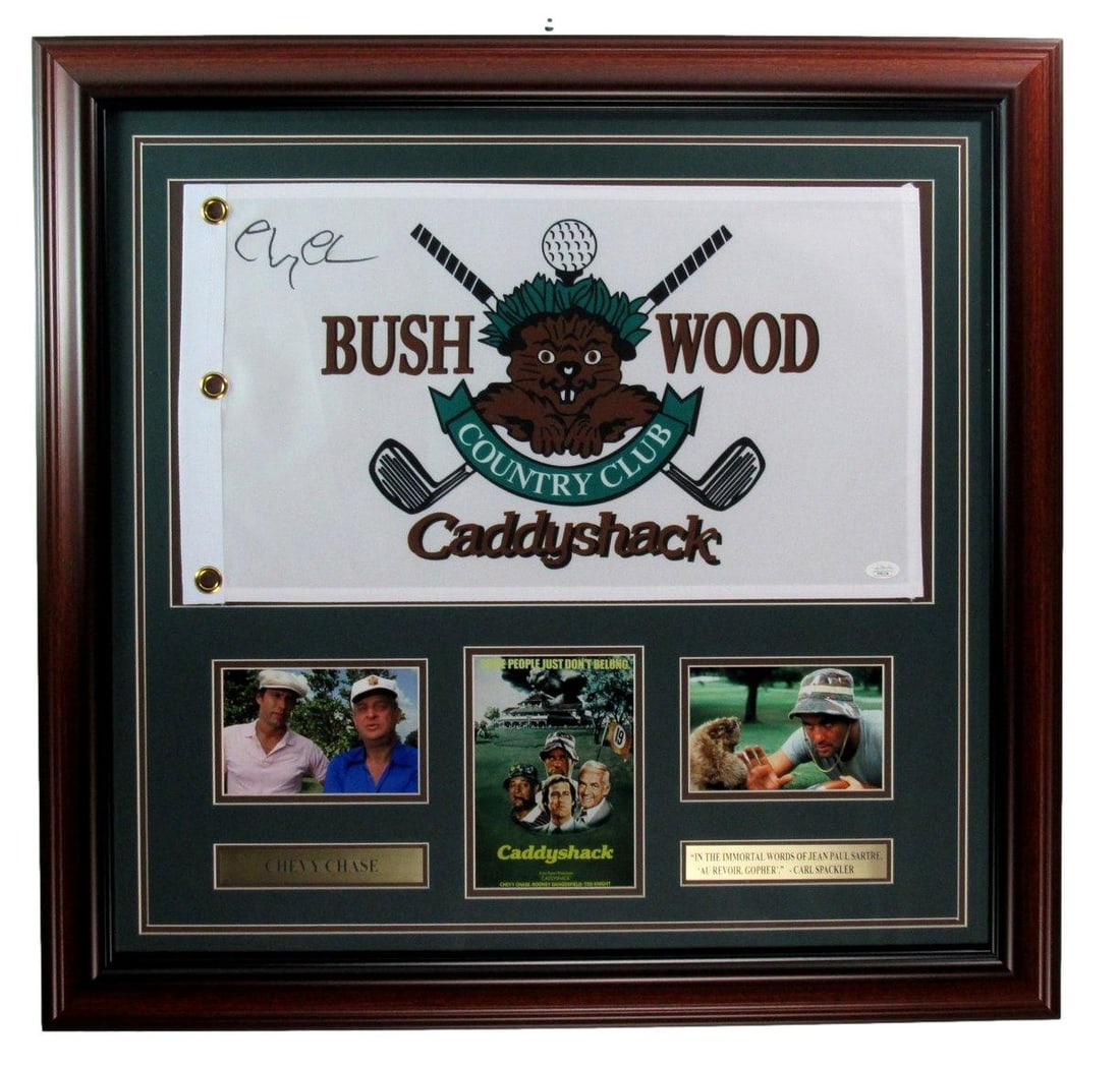 Chevy Chase Signed/ Auto "Caddy Shack" Pin Flag w/ Photos Framed JSA 189732: Chevy Chase Signed/ Auto "Caddy Shack" Pin Flag w/ Photos Framed JSA 189732 The iconic Chevy Chase "Caddy Shack" pin flag, signed and framed with photos, is a unique collectible for movie enthusiasts 
