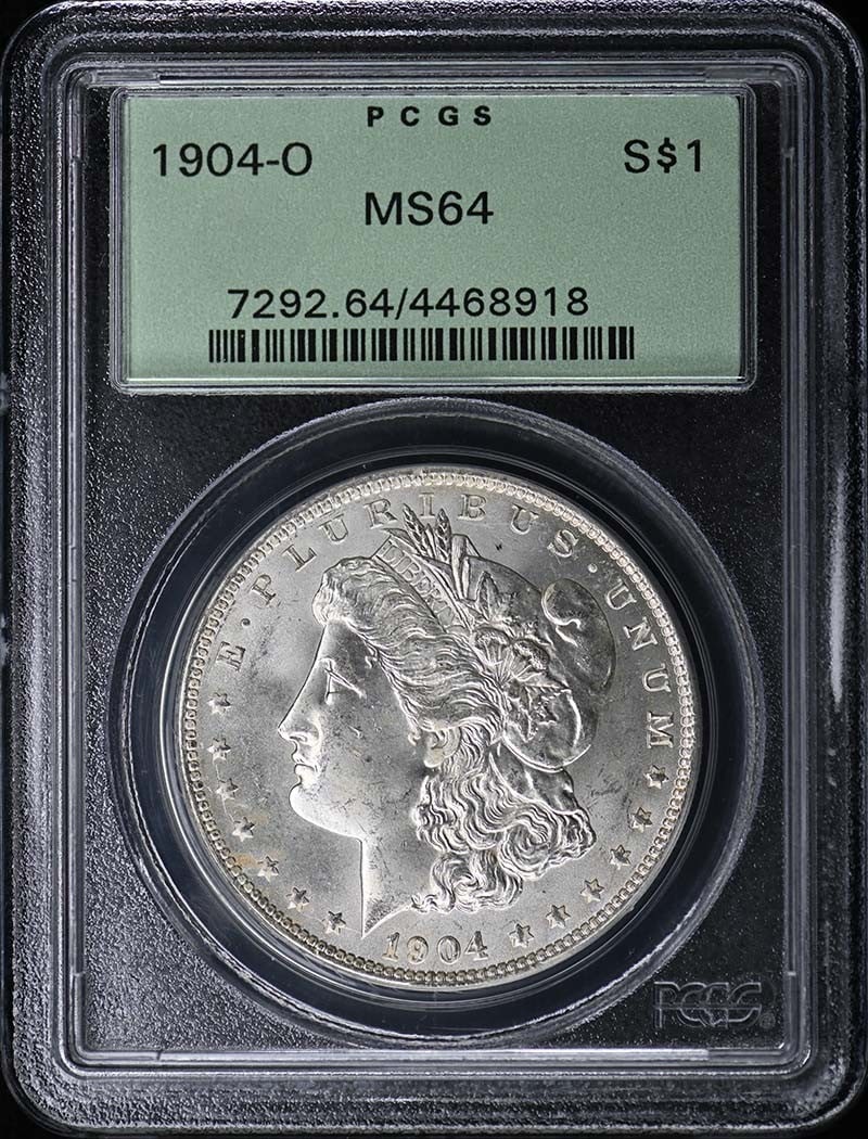 $1 Morgan Dollar 1904-O PCGS MS64: $1 Morgan Dollar 1904-O PCGS MS64 The 1904-O Morgan Dollar, graded MS64 by PCGS, is a highly detailed and well-preserved example of this iconic coin. Certified by the prestigious Professional Coin Gra