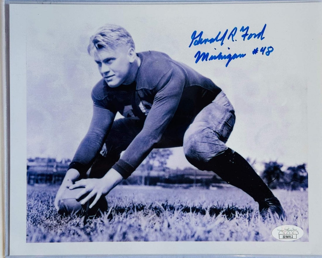Gerald Ford Autographed 8x10 Photo (JSA): Gerald Ford Autographed 8x10 Photo (JSA) Signed across the front of the photo in blue sharpie by the 38th President of the United States, this 8x10 photo bears the inscription "Michigan #48". The Jame