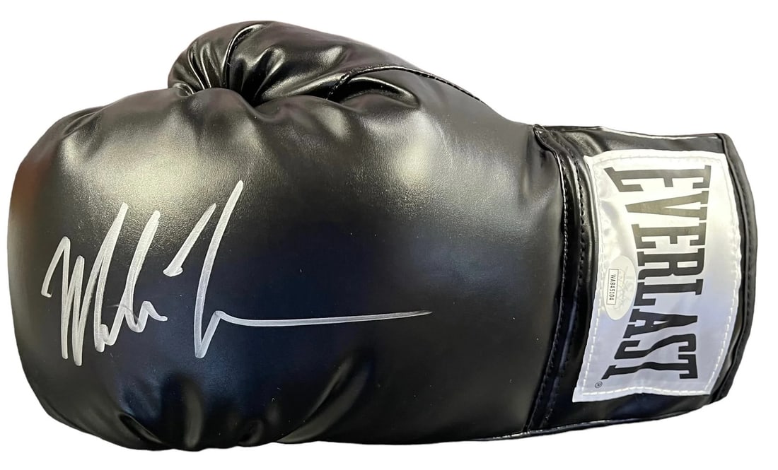Mike Tyson Autographed Black Everlast Left Boxing Glove (JSA): Mike Tyson Autographed Black Everlast Left Boxing Glove (JSA) Authentic Mike Tyson Autographed Black Everlast Left Boxing Glove. This black Everlast boxing glove has been signed by Mike Tyson using a 