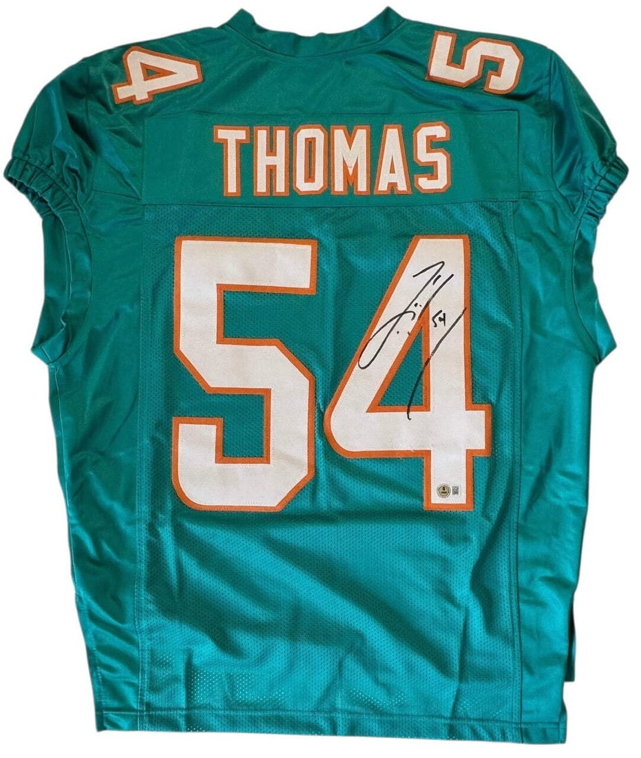 Zach Thomas Autographed Beckett Witness Dolphins Jersey Custom Miami: Zach Thomas Autographed Beckett Witness Dolphins Jersey Custom Miami Zach Thomas' sharpie signature on the jersey number of this custom Miami Dolphins jersey is a unique touch. The item is a 100%