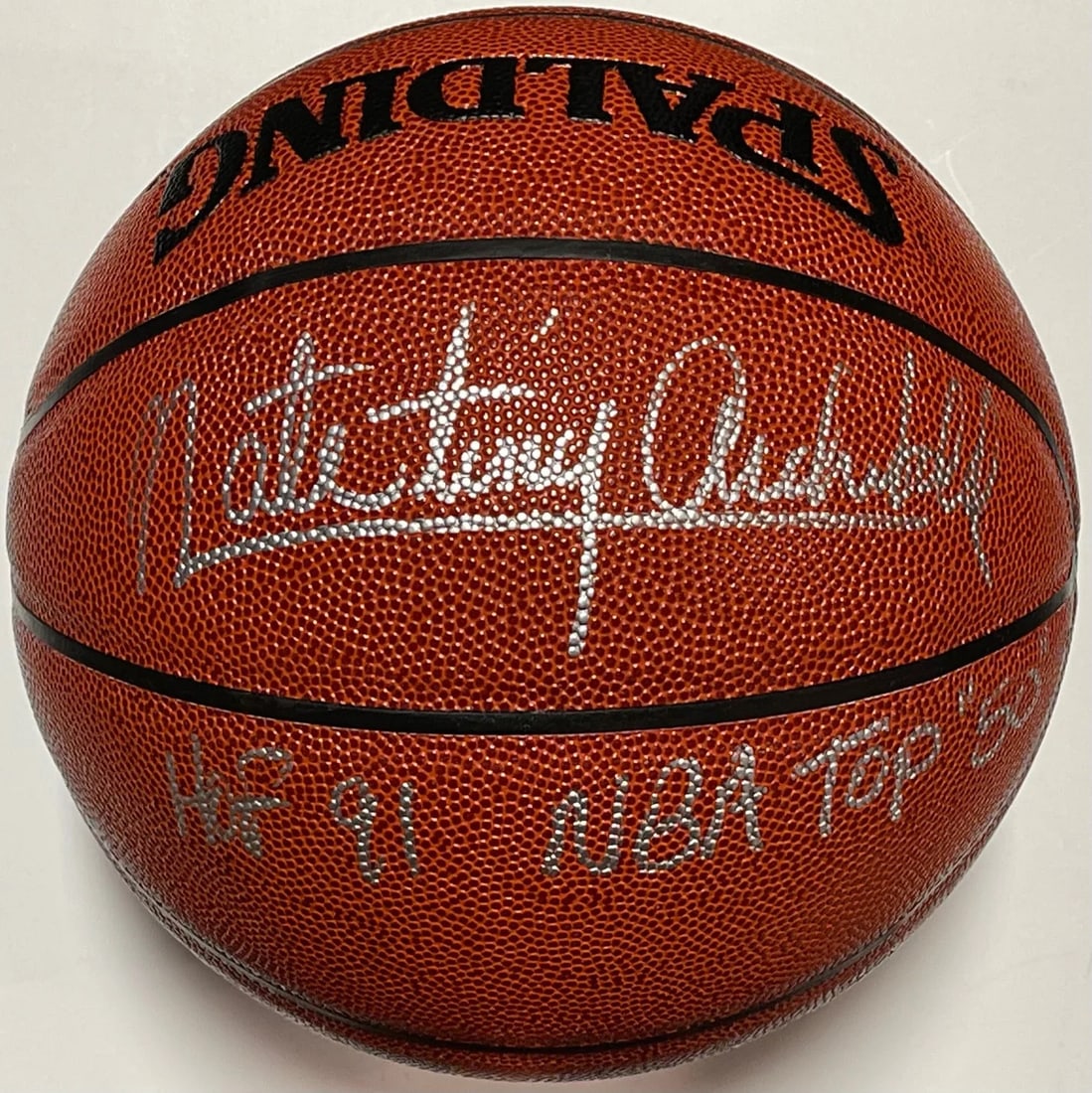 Nate Archibald Autographed Spalding Indoor/ Outdoor Basketball: Nate Archibald Autographed Spalding Indoor/ Outdoor Basketball Nate Archibald's signature is prominently displayed in silver paint pen across the front of this Spalding Indoor/Outdoor Basketball,