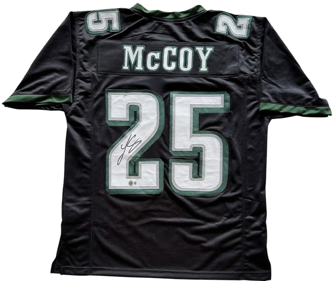 LeSean McCoy Autographed Philadelphia Eagles Custom Jersey (Beckett): LeSean McCoy Autographed Philadelphia Eagles Custom Jersey (Beckett) Signed in black sharpie across the number on the back of a custom Philadelphia Eagles jersey, this item bears the mark of LeSean