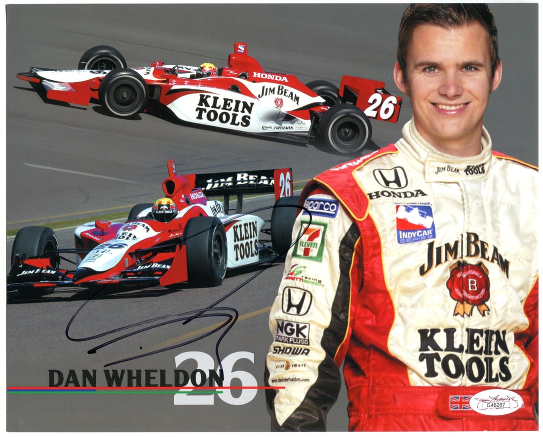 Dan Wheldon Autographed 8x12 Photo (JSA): Dan Wheldon Autographed 8x12 Photo (JSA) Dan Wheldon's bold signature in black sharpie is prominently displayed on this 8x12 photo, a unique and personal touch for any fan or collector. The item comes