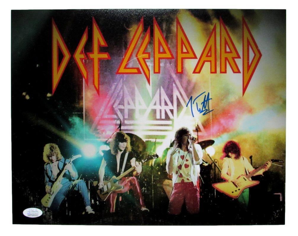Def Leppard Joe Elliott Autographed 11x14 Photo Group: Def Leppard Joe Elliott Autographed 11x14 Photo Group Signed by Joe Elliott, the iconic lead vocalist of Def Leppard, this 11x14 photo group is a must-have for any music enthusiast. The JSA authentica