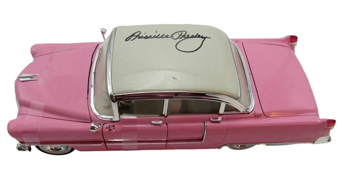 Signed 1 18 Scale Pricilla Presley 1955 Cadillac Pink Greenlight Diecast Car: Signed 1 18 Scale Pricilla Presley 1955 Cadillac Pink Greenlight Diecast Car Signed by Priscilla Presley, this 1955 Cadillac model in pink and greenlight diecast form bears a notable signature. The 18
