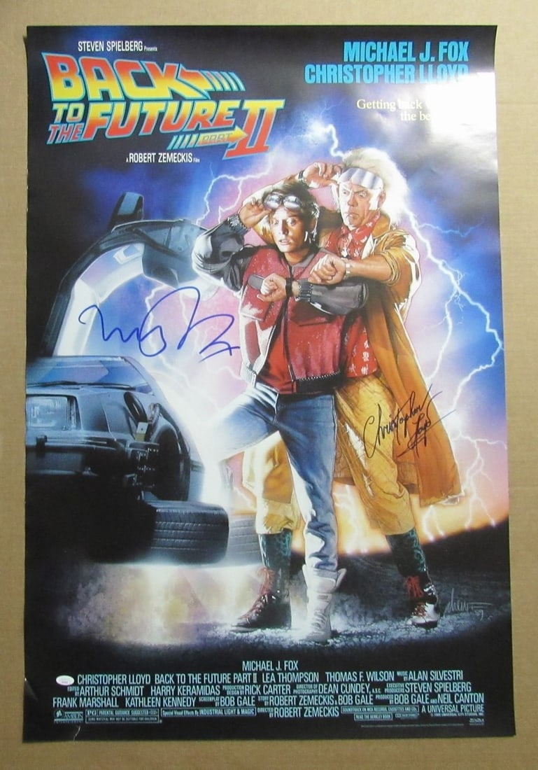 Michael J Fox Christopher Lloyd Signed 27x40 Poster Back to Future II JSA 972: Michael J Fox Christopher Lloyd Signed 27x40 Poster Back to Future II JSA 972 This 27x40 inch poster from the iconic film Back to the Future II features a signed image of Michael J. Fox and