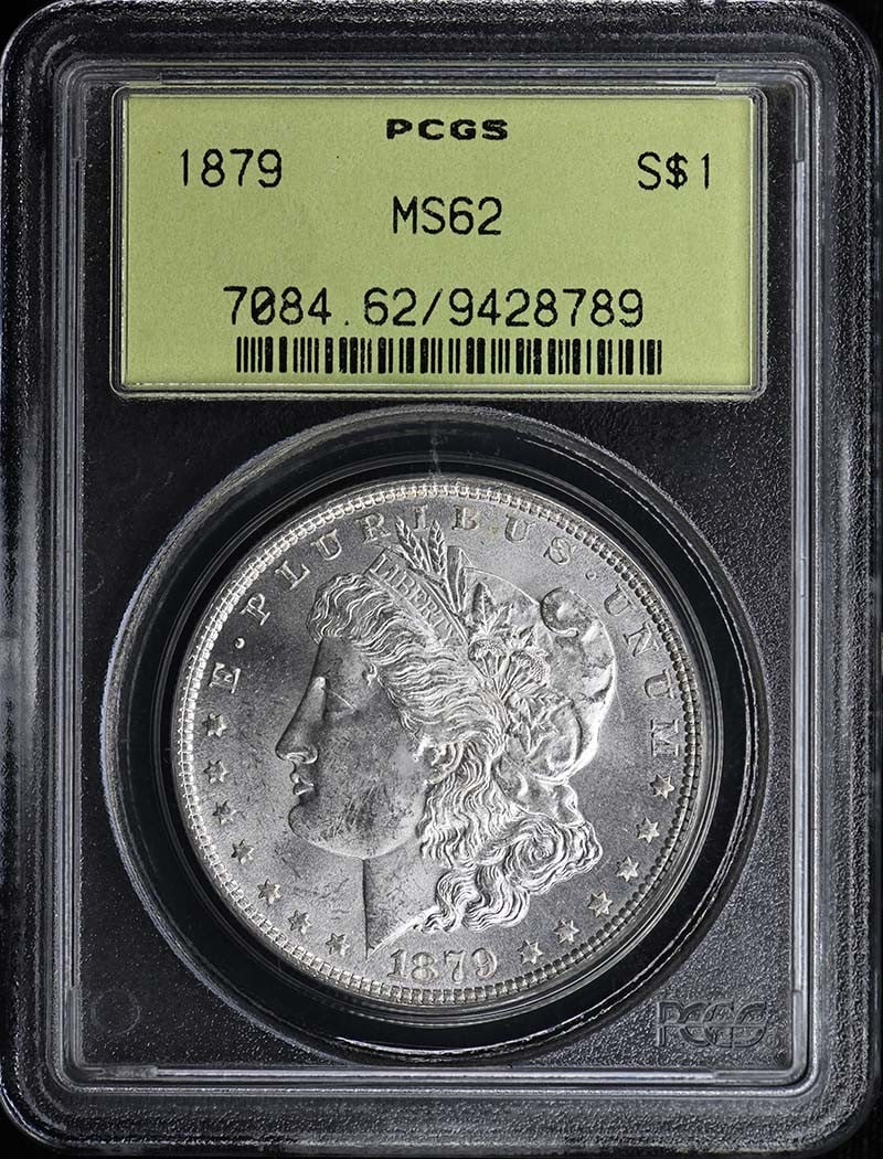 1879 $1 Morgan Dollar PCGS MS62: 1879 $1 Morgan Dollar PCGS MS62 The 1879 $1 Morgan Dollar is a highly detailed and ornate coin, featuring a striking design with Lady Liberty on the obverse and an eagle on the reverse. Certified by P