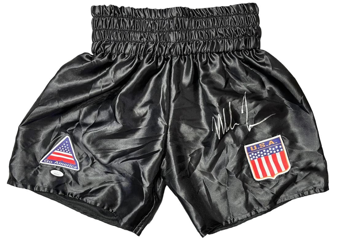 Boxing trunks autographed by Mike Tyson.: Boxing trunks autographed by Mike Tyson. Authentic Mike Tyson autographed boxing trunks in silver paint pen, verified by James Spence Authentication. The trunks bear a signature from the boxing legend