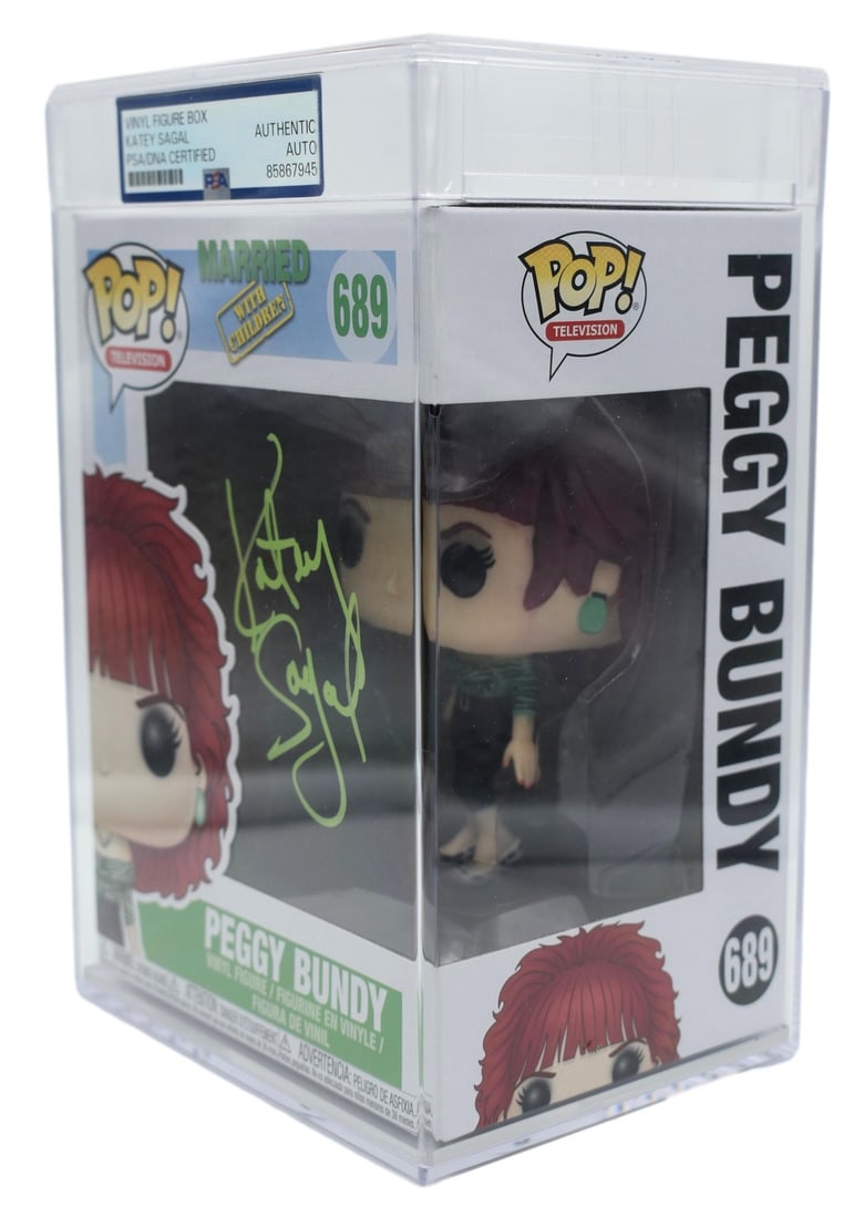 Katey Sagal Signed/ Auto Funko Pop #689 Peggy Bundy Encapsulated PSA/ DNA 212870: Katey Sagal Signed/ Auto Funko Pop #689 Peggy Bundy Encapsulated PSA/ DNA 212870 Katey Sagal's signature on this Funko Pop #689 Peggy Bundy is a notable feature of this collectible item. The item is e