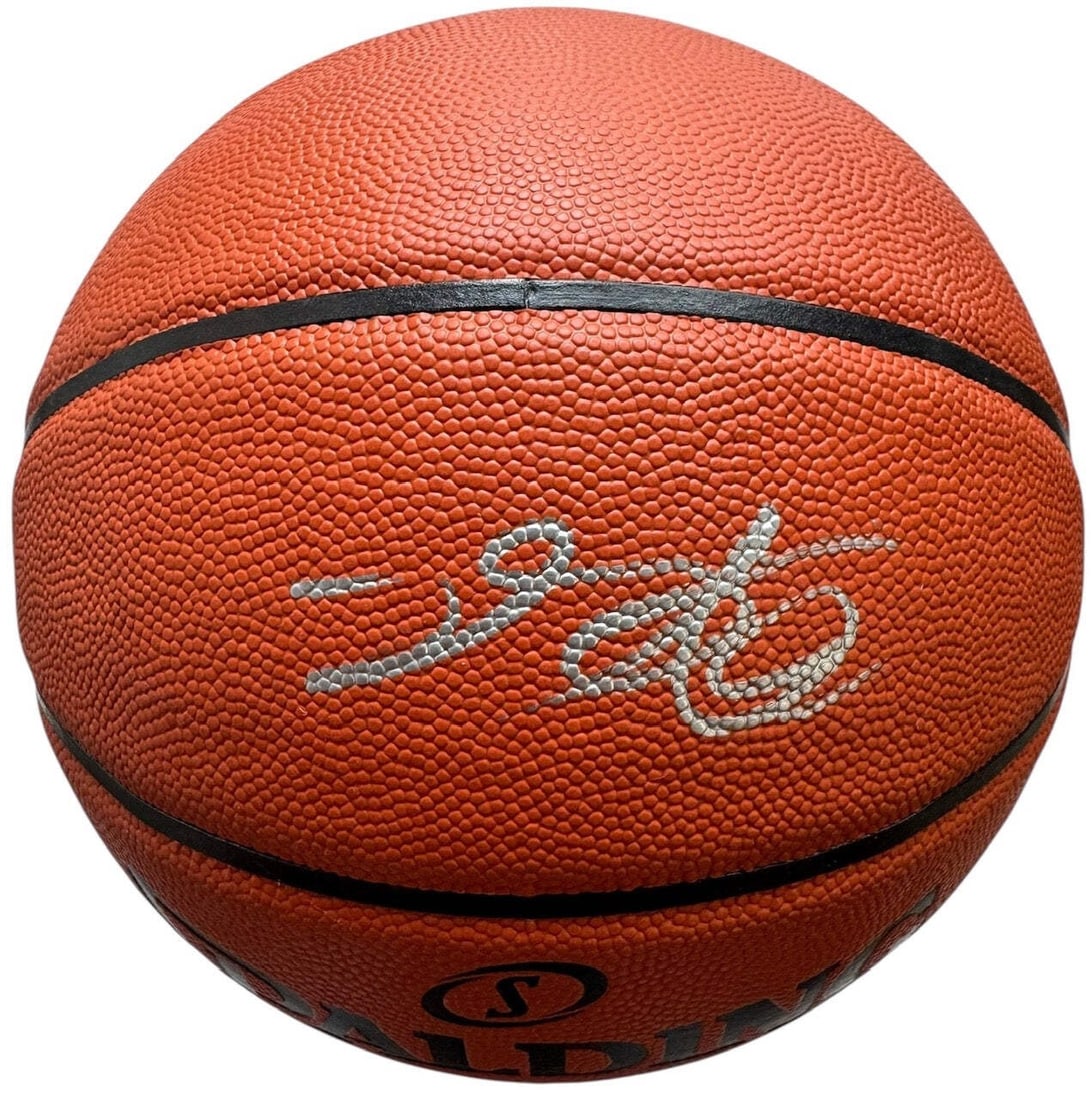 Spalding Hybrid Basketball Autographed By DeAaron Fox: Spalding Hybrid Basketball Autographed By DeAaron Fox Signed in silver paint pen above the Spalding logo on a Adam Silver ball, this Spalding Hybrid Basketball bears the mark of DeAaron Fox. The item 
