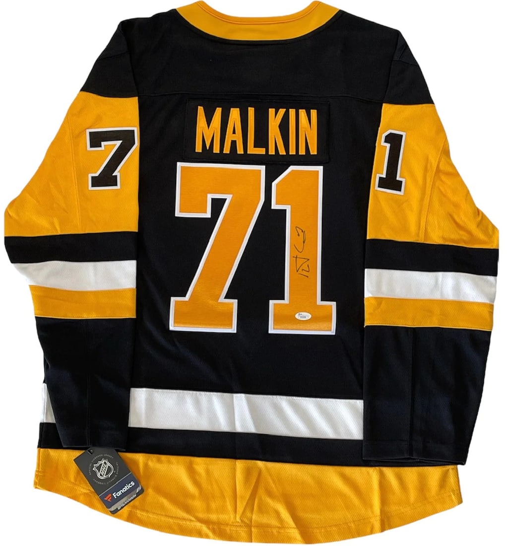 Malkin Autographed Penguins Fanatics Evgeni XL Jersey JSA: Malkin Autographed Penguins Fanatics Evgeni XL Jersey JSA Authentic Evgeni Malkin signed Pittsburgh Penguins Fanatics XL jersey, bearing a black sharpie signature across the #1 on the back. This offic