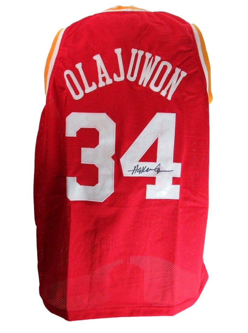 Hakeem Olajuwon Signed/ Auto Red Custom Basketball Jersey Rockets JSA 204282: Hakeem Olajuwon Signed/ Auto Red Custom Basketball Jersey Rockets JSA 204282 Authentic Hakeem Olajuwon Signed Red Custom Basketball Jersey from the Houston Rockets, verified by James Spence Authentica