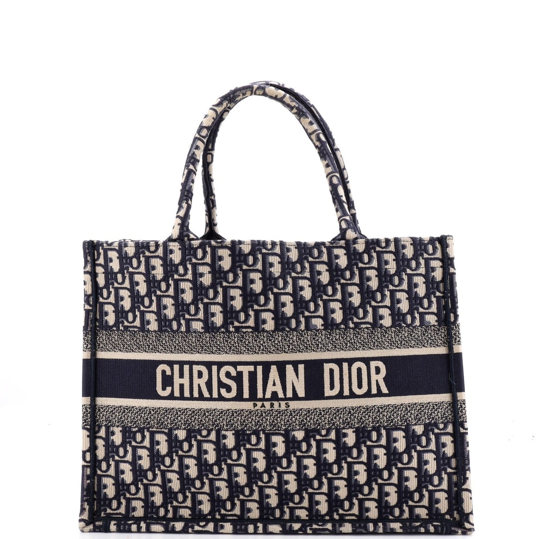 Dior Canvas Book Tote Medium Christian Oblique: Dior Canvas Book Tote Medium Christian Oblique Blue canvas medium Christian oblique book tote with a classic design, featuring a scuffed exterior and minor creases, and a light odor inside. The item m