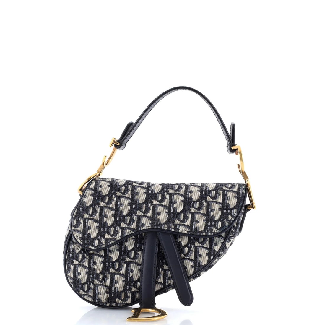 Saddle Handbag Oblique Mini Canvas Dior Christian: Saddle Handbag Oblique Mini Canvas Dior Christian The Saddle Handbag Oblique Mini Canvas Dior Christian is a stylish and compact shoulder bag featuring a blue canvas exterior with a neutral interior. 