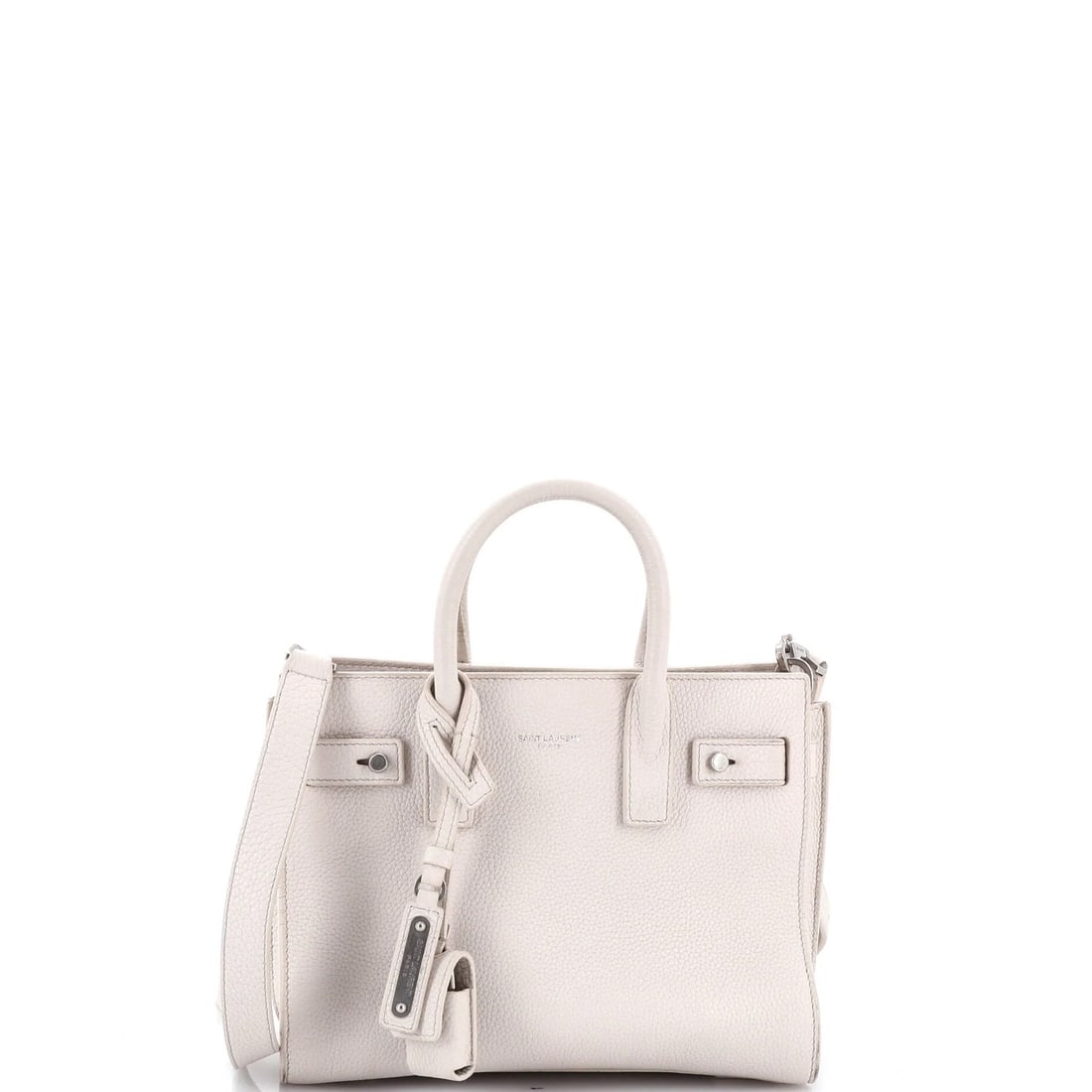 Sac de Jour Souple Bag Saint Laurent Nano Leather: Sac de Jour Souple Bag Saint Laurent Nano Leather The Sac de Jour Souple Bag Saint Laurent Nano Leather is a neutral-toned, nano-sized tote with a sleek leather exterior and suede interior. Notable fo