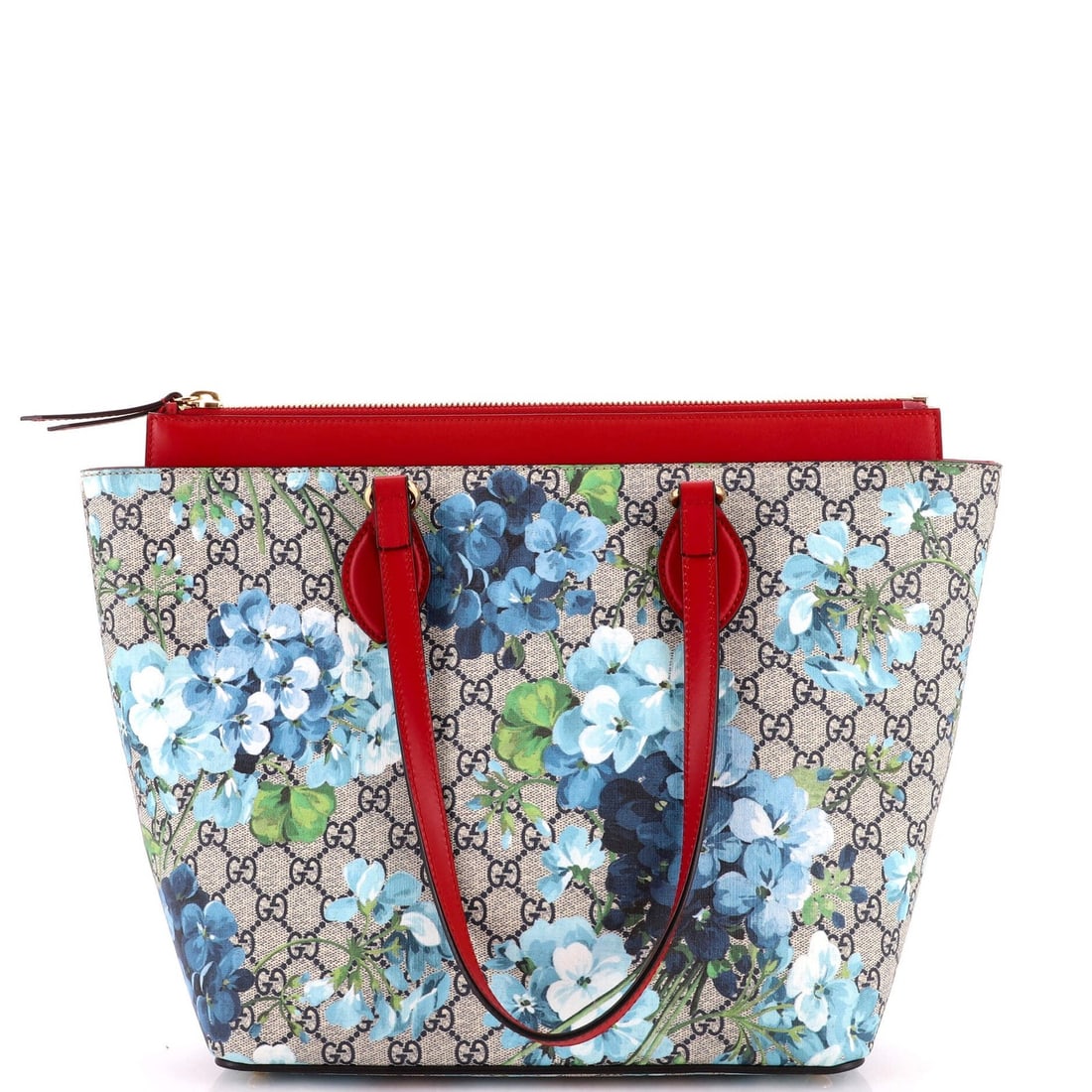 Gucci Coated Canvas Medium Blooms Print GG Zip Tote Linea A: Gucci Coated Canvas Medium Blooms Print GG Zip Tote Linea A Navy blue canvas coated GG print tote bag from Gucci's Linea A collection, featuring a medium size with 8" handle drop and 12" height. Minor