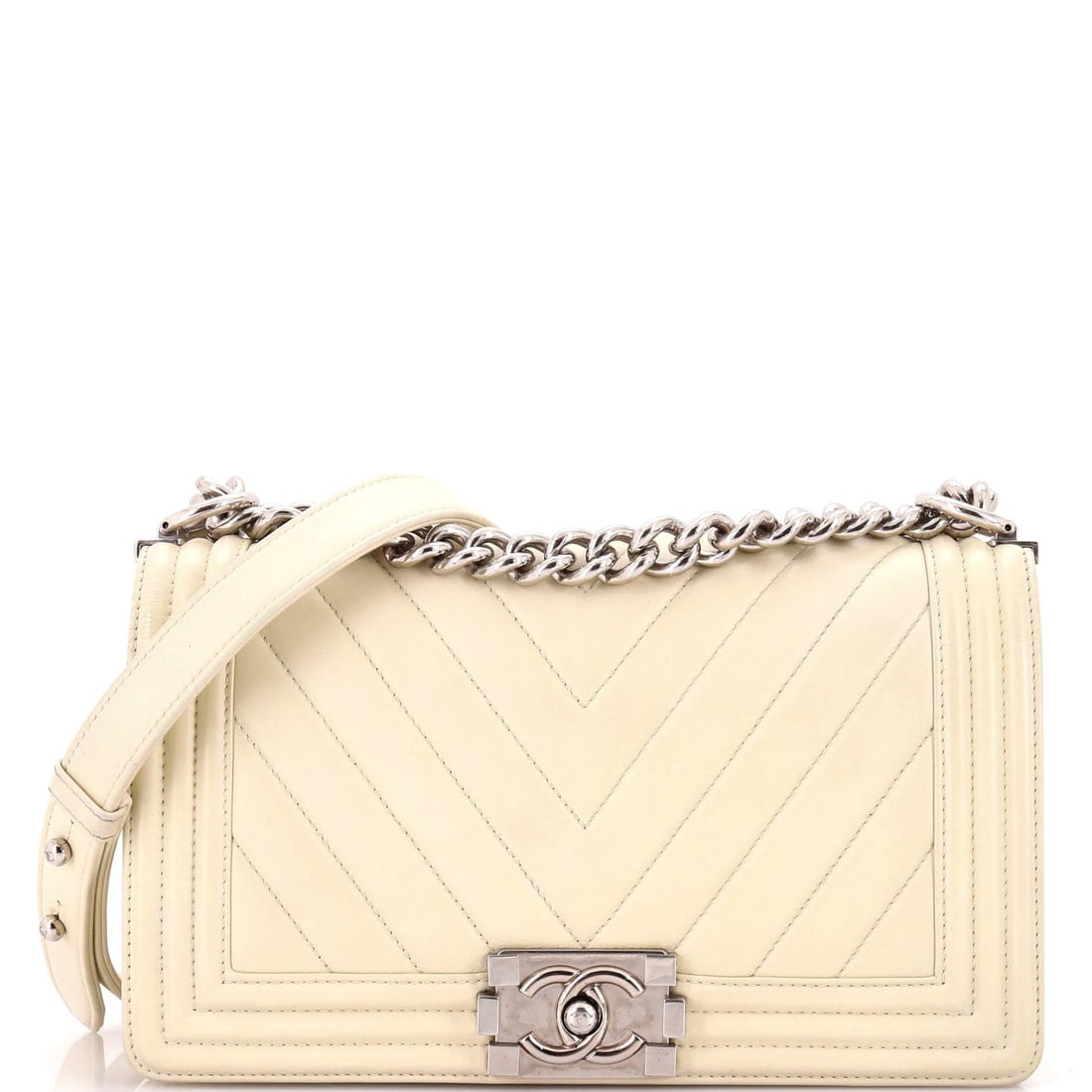 Chanel boy flap bag lambskin old medium: Chanel boy flap bag lambskin old medium Chanel's iconic Boy Flap Bag is a timeless classic, featuring a neutral lambskin exterior and a spacious interior with a gray fabric lining. With its signature 