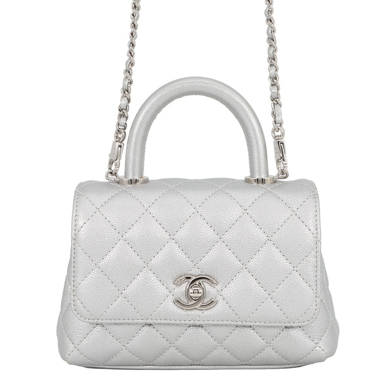 CHANEL Handbag Grained Calfskin: CHANEL Handbag Grained Calfskin Grained Calfskin Handbag from CHANEL's Matelasse Line. This silver hardware adorned, flap closure handbag features a classic design with a subtle sheen from the