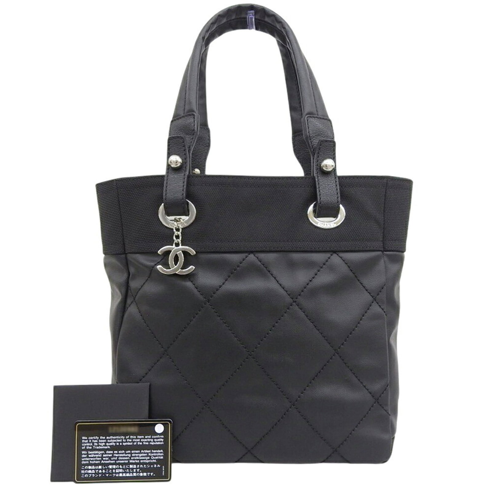 CHANEL Handbag Tote Bag Coated Canvas Leather: CHANEL Handbag Tote Bag Coated Canvas Leather Coated canvas and leather combine in this sleek black Chanel tote bag, measuring 27cm x 25cm x 11cm. In like new condition, it features a subtle yet