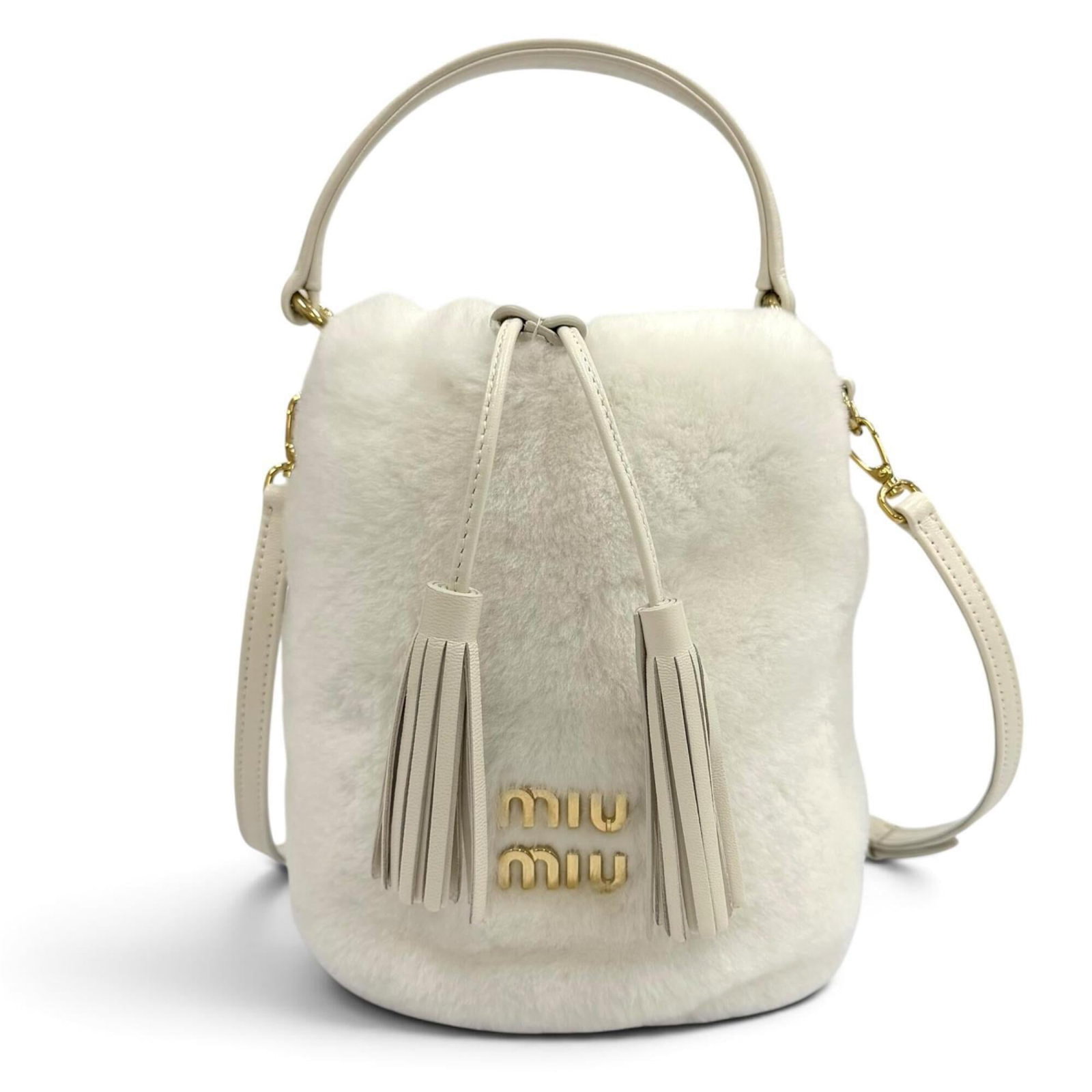 MIU MIU Shoulder Bag Fur: MIU MIU Shoulder Bag Fur White fur shoulder bag from Miu Miu, featuring gold hardware and a sleek design. Made from high-quality fur, this bag is in like new condition, with only the faintest traces