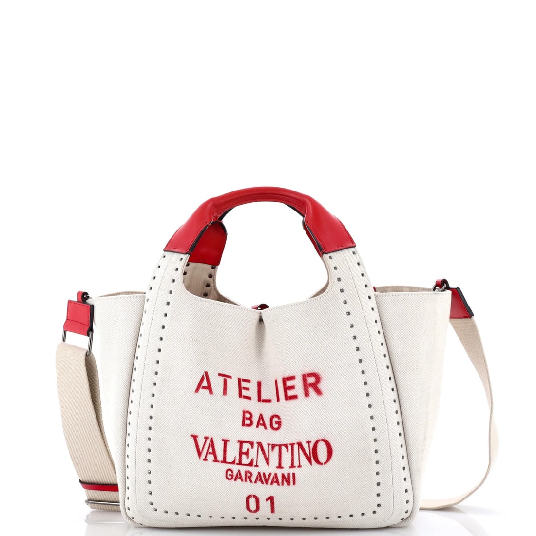 Valentino Garavani Atelier Tote Studded Canvas Medium: Valentino Garavani Atelier Tote Studded Canvas Medium Valentino Garavani Atelier Tote Studded Canvas Medium features a neutral exterior with a subtle studded design, crafted from high-quality canvas.