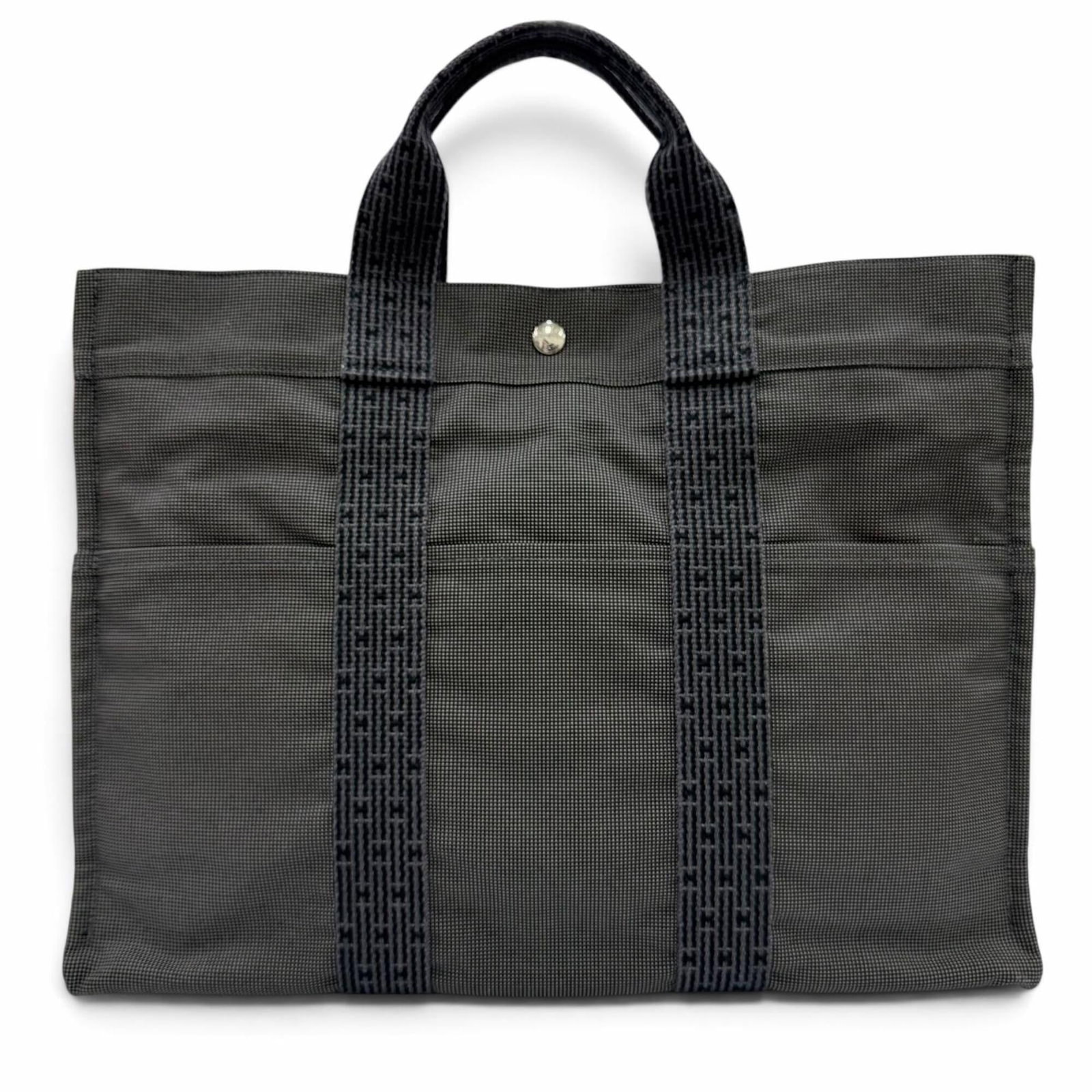 HERMES Handbag Tote Bag Polyamide Polyester: HERMES Handbag Tote Bag Polyamide Polyester Polyamide and polyester blend materials make this Herm?s tote bag durable and long-lasting. The gray color and silver hardware add a touch of sophistication