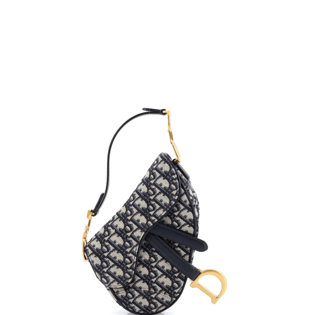 Saddle Handbag Oblique Mini Canvas Dior Christian: Saddle Handbag Oblique Mini Canvas Dior Christian The Saddle Handbag Oblique Mini Canvas Dior Christian is a stylish and compact shoulder bag featuring a blue canvas exterior with a neutral interior.