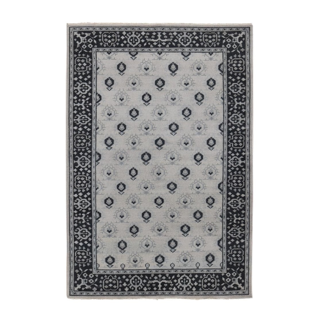 6'x9' Cream Color Small Intricate Repetitive Design Wool Hand Knotted Rug: 6'x9' Cream Color Small Intricate Repetitive Design Wool Hand Knotted Rug The 6'x9' cream-colored wool hand-knotted rug boasts an intricate, repetitive design, adding a touch of elegance to any room. 