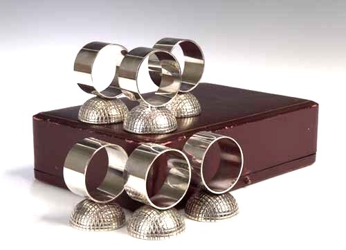 A set of six plated napkin rings in the