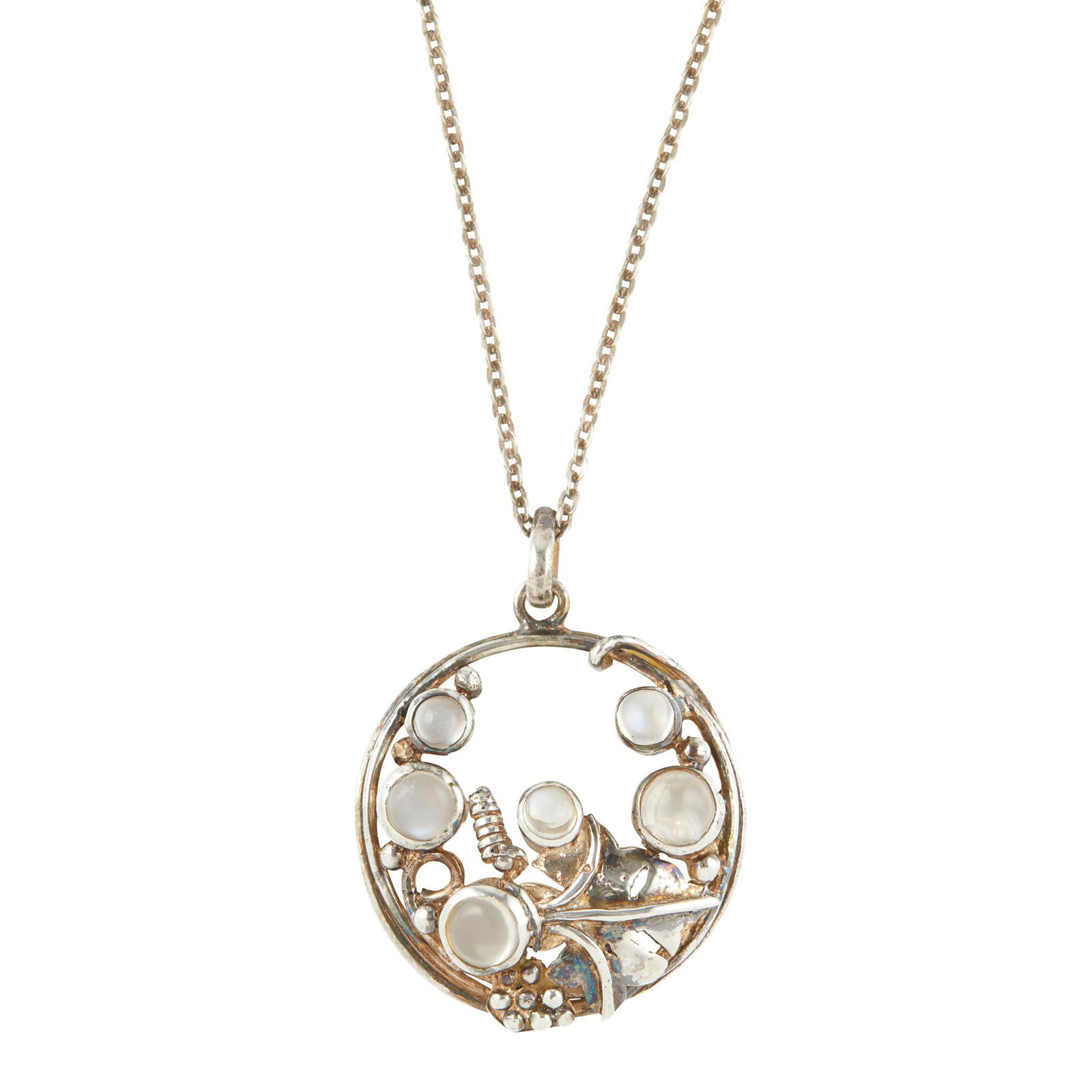 Â§ DORRIE NOSSITER (1893-1977) ARTS & CRAFTS WHITE: Â§ DORRIE NOSSITER (1893-1977) ARTS & CRAFTS WHITE METAL AND MOONSTONE SET PENDANT, CIRCA 1910 with associated chain (pendant 2.7cm diameter; total length 24cm)