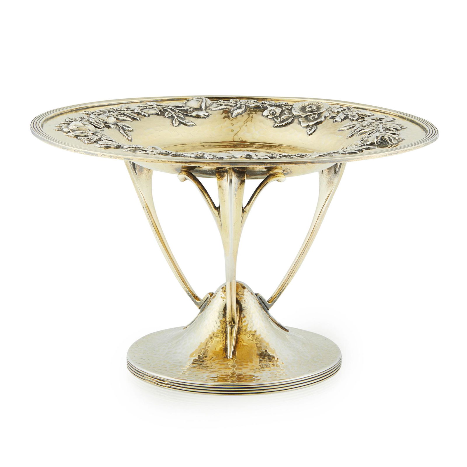 PHILIP HANSON ABBOT ARTS & CRAFTS SILVER-GILT: PHILIP HANSON ABBOT ARTS & CRAFTS SILVER-GILT CENTREPIECE TAZZA, LONDON, 1909 with a hammered finish, chased and embossed with a garland of budding roses and flowers, raised on curved tripod supports