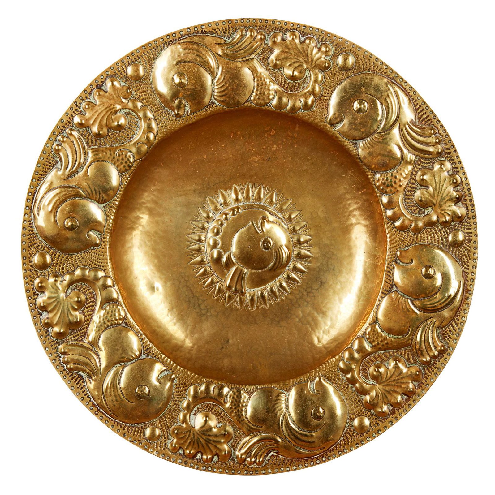 MANNER OF JOHN PEARSON THREE ARTS & CRAFTS CHARGERS: MANNER OF JOHN PEARSON THREE ARTS & CRAFTS CHARGERS CIRCA 1890 comprising a BRASS CHARGER, repoussÃ© decorated with stylised fish, marked to reverse 501/1£13-0, 39cm diameter; a COPPER CHARGER, rep