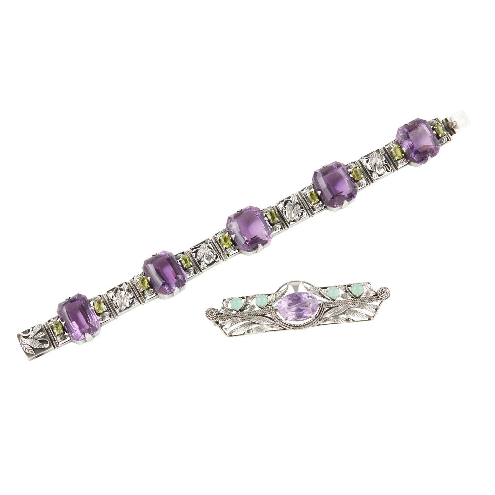 ATTRIBUTED TO BERNARD INSTONE SILVER AND GEM SET: ATTRIBUTED TO BERNARD INSTONE SILVER AND GEM SET BRACELET, EARLY 20TH CENTURY the six amethyst coloured stones flanked by peridots and cast foliate panels, the locking clasp stamped SILVER, 19.5cm lon