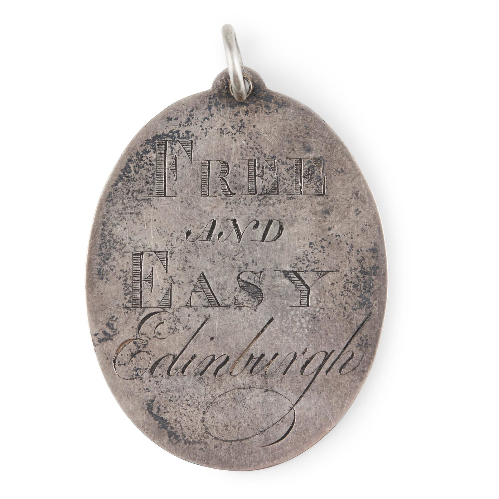 A silver pass for Free And Easy Club, Edinburgh: unmarked, an oval engraved silver admission ticket, rev. crest, named (Wa Williamson Admitted 26 Jan 1786), with integral suspension loop (Dimensions: 4.4 x 3.1cm) (4.4 x 3.1cm) Footnote: Provenance: 