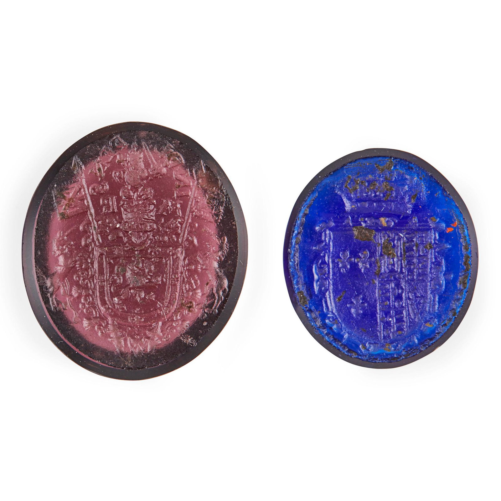Two unset glass intaglio seals relating to Mary Queen: both oval, the matrices appear to be associated with Mary, Queen of Scots, the red matrix with the signet of the queen, whilst the other appears to be the marital arms of the Queen and her first husba