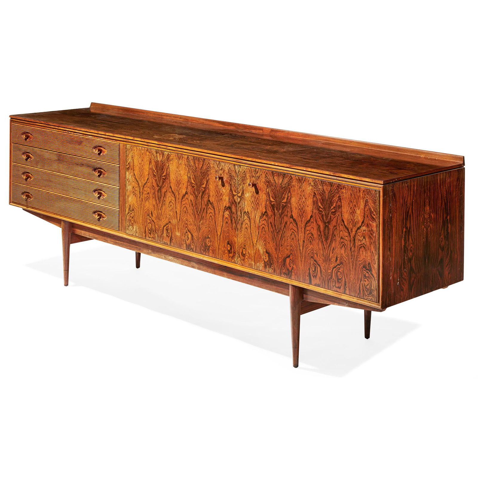 Y ROBERT HERITAGE (BRITISH 1927-) FOR ARCHIE SHINE: rosewood, with manufacturer's label (Dimensions: 88.5cm high, 229cm wide, 51cm deep (31in high, 90in wide, 20in deep))(88.5cm high, 229cm wide, 51cm deep (31in high, 90in wide, 20in deep))Footnote: No