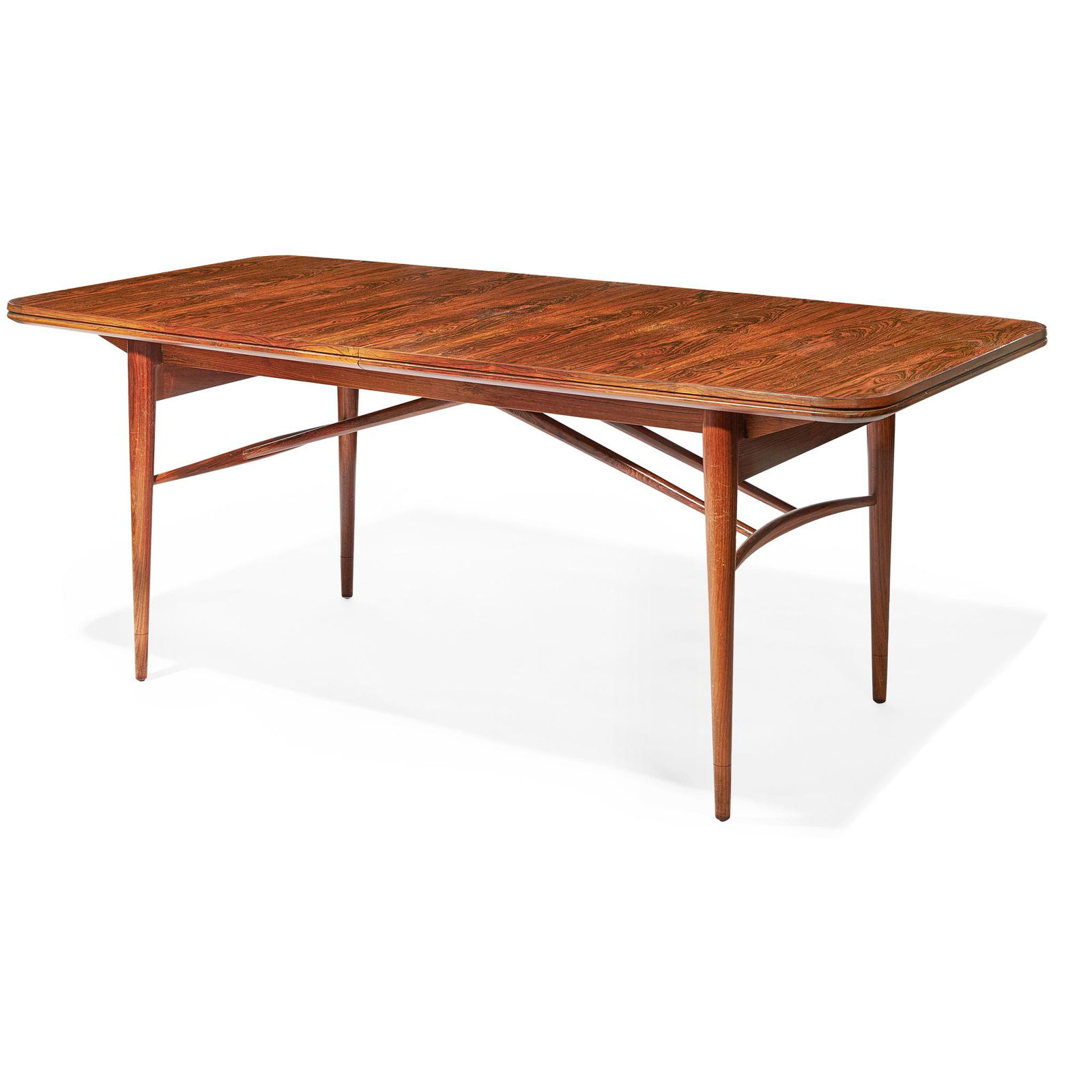 Y ROBERT HERITAGE (BRITISH 1927-) FOR ARCHIE SHINE: rosewood, the dining table with two extra leaves, and the chairs with blue upholstery, including two carver chairs (Dimensions: the dining table 242cm long, 88cm wide, 73cm high (95in long, 34.75in wi