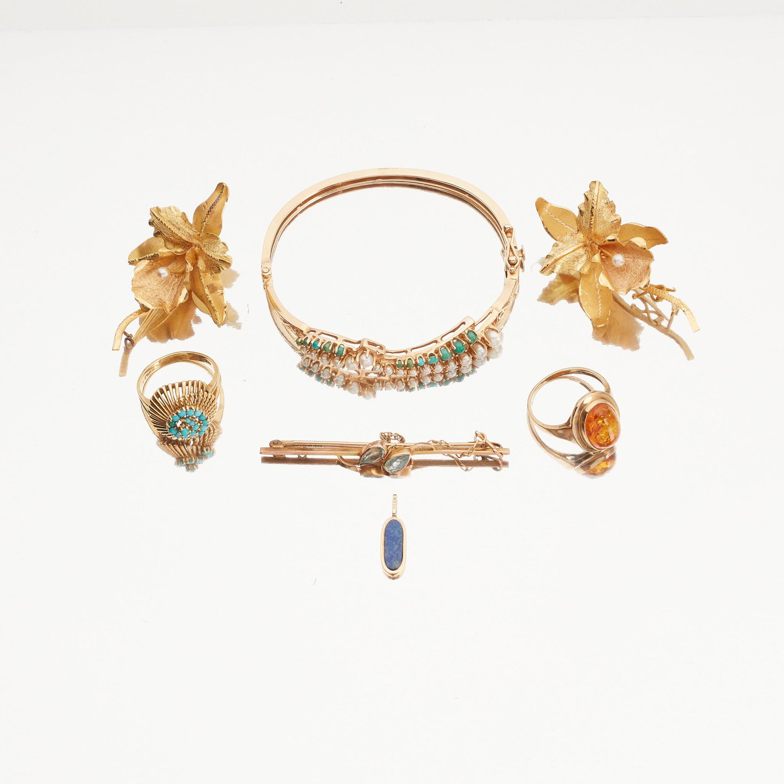 A collection of gem-set jewellery: A collection of gem-set jewellery to include a turquoise and pearl set hinged bangle, stamped 14k; a turquoise set dress ring, stamped 18k; a 9ct gold aquamarine set bar brooch, a 9ct gold amber set r