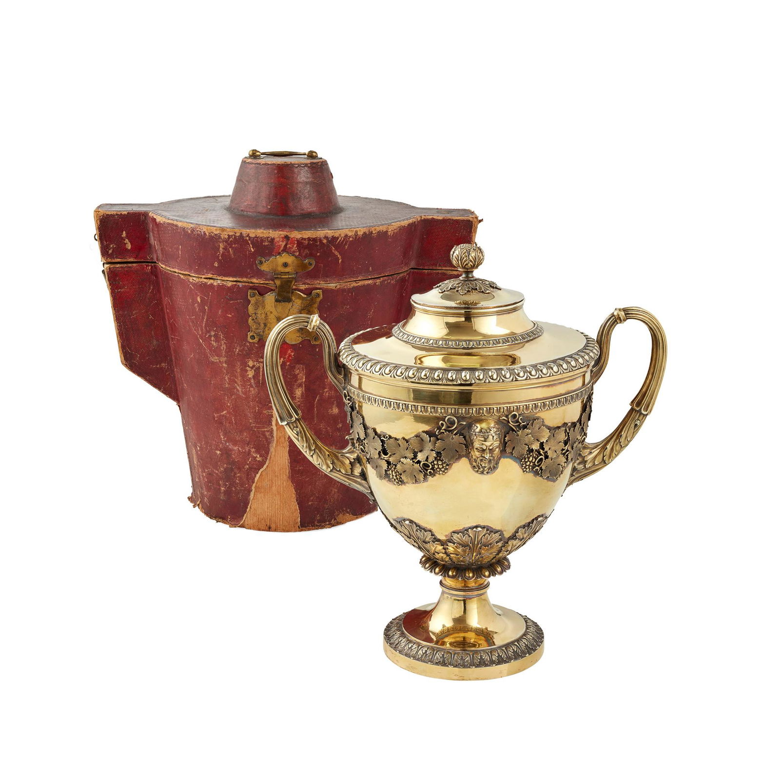 An impressive cased George III silver-gilt twin handled: An impressive cased George III silver-gilt twin handled cup and cover Benjamin Smith II & James Smith III, London 1810, the cup of traditional Neo-Classical urn form with a cast foliate border, two hi