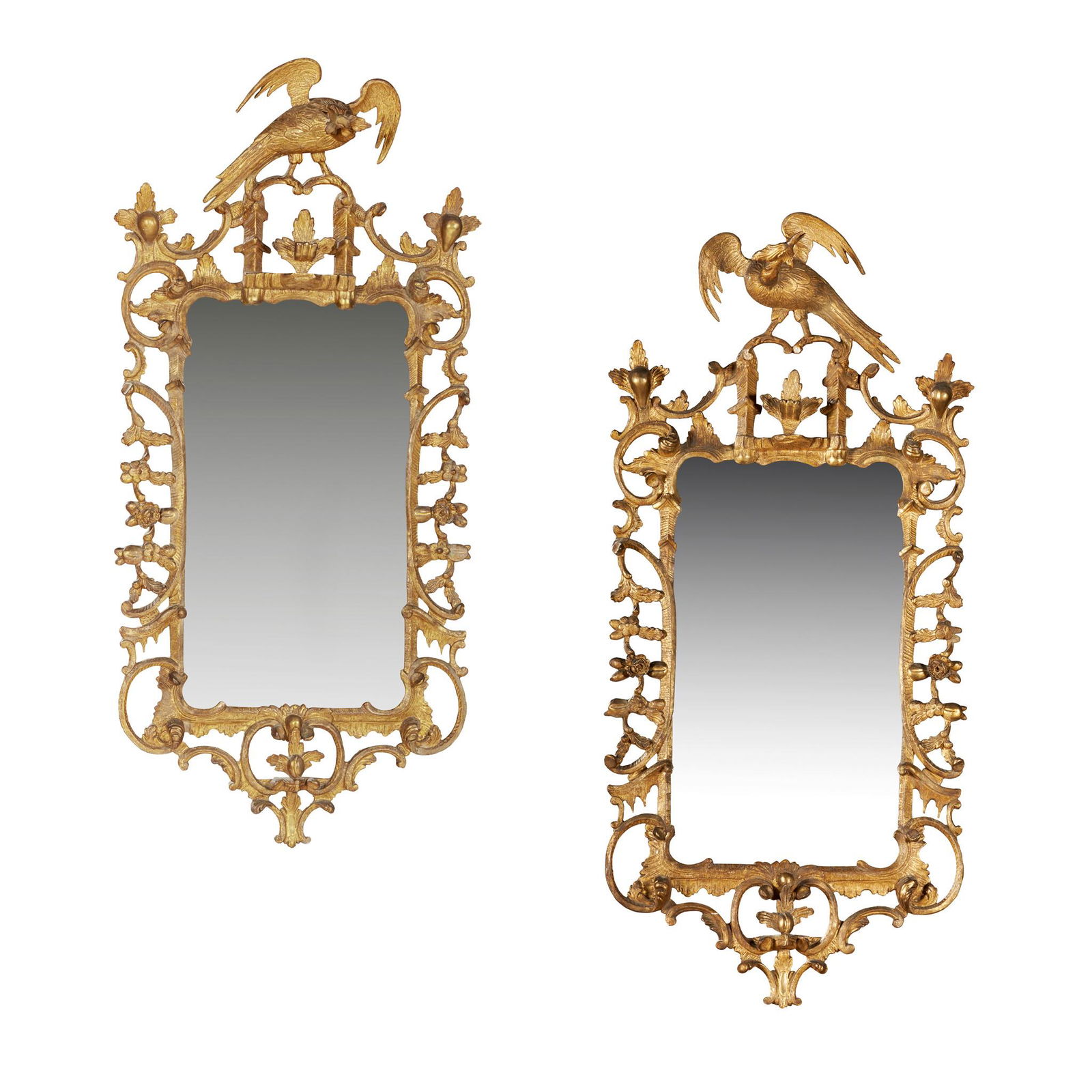 PAIR OF GEORGE III STYLE GILTWOOD MIRRORS, IN THE: PAIR OF GEORGE III STYLE GILTWOOD MIRRORS, IN THE MANNER OF THOMAS CHIPPENDALE 19TH CENTURY the rectangular mirror plates in rococo style frames carved with rocaille, C scrolls, fruit and flower trail
