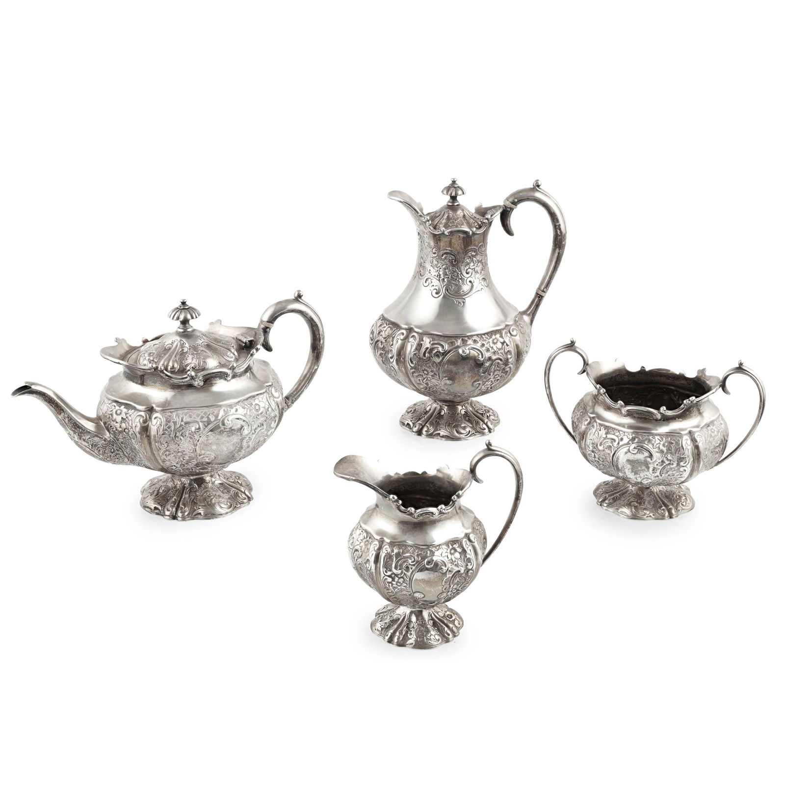 Y A late Victorian four-piece tea set: Y A late Victorian four-piece tea set John Alexander Fettes, Glasgow 1901, comprising a waterpot, teapot, twin-handled sugar basin and a milk jug, each of baluster form, with embossed floral detail, S