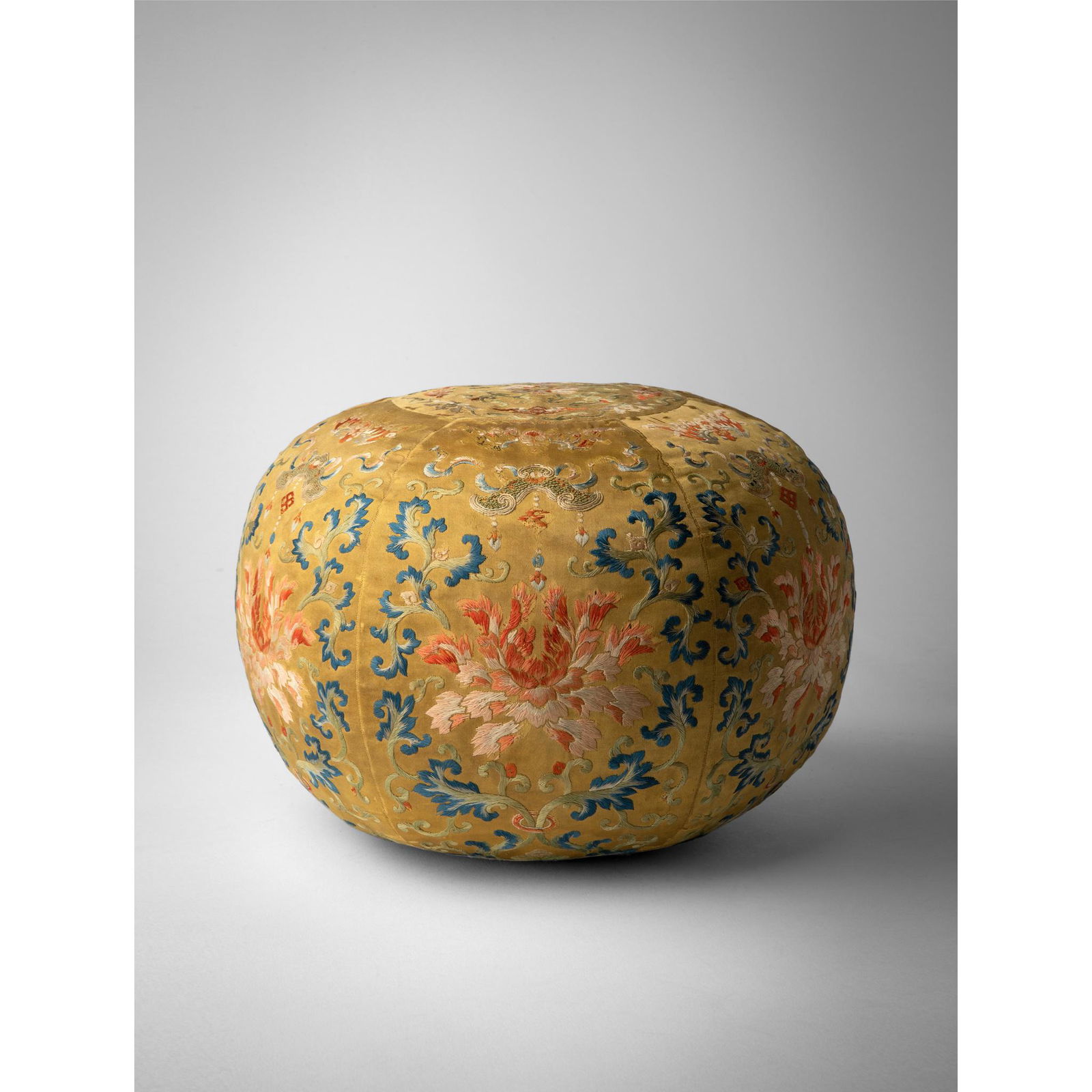 YELLOW-GROUND EMBROIDERED SILK 'LOTUS' SPHERICAL ELBOW CUSHION QING DYNASTY, 19TH CENTURY (1 of 3)