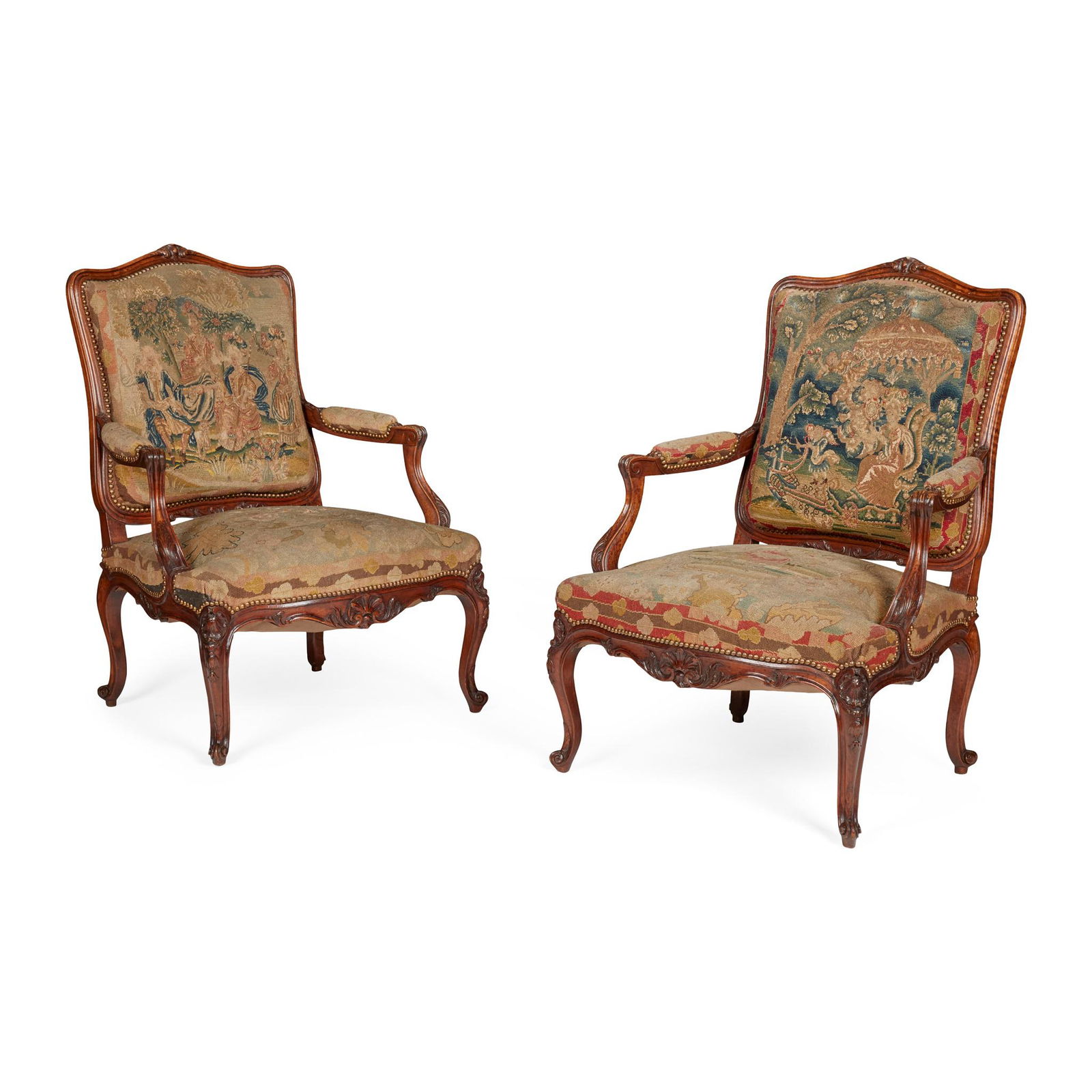 PAIR OF FRENCH WALNUT CHAISES À LA REINE 19TH CENTURY, THE COVERS 18TH CENTURY: PAIR OF FRENCH WALNUT CHAISES À LA REINE 19TH CENTURY, THE COVERS 18TH CENTURY the wide padded backs in channel moulded and foliate carved frames, above wide serpentine seats flanked by part padd