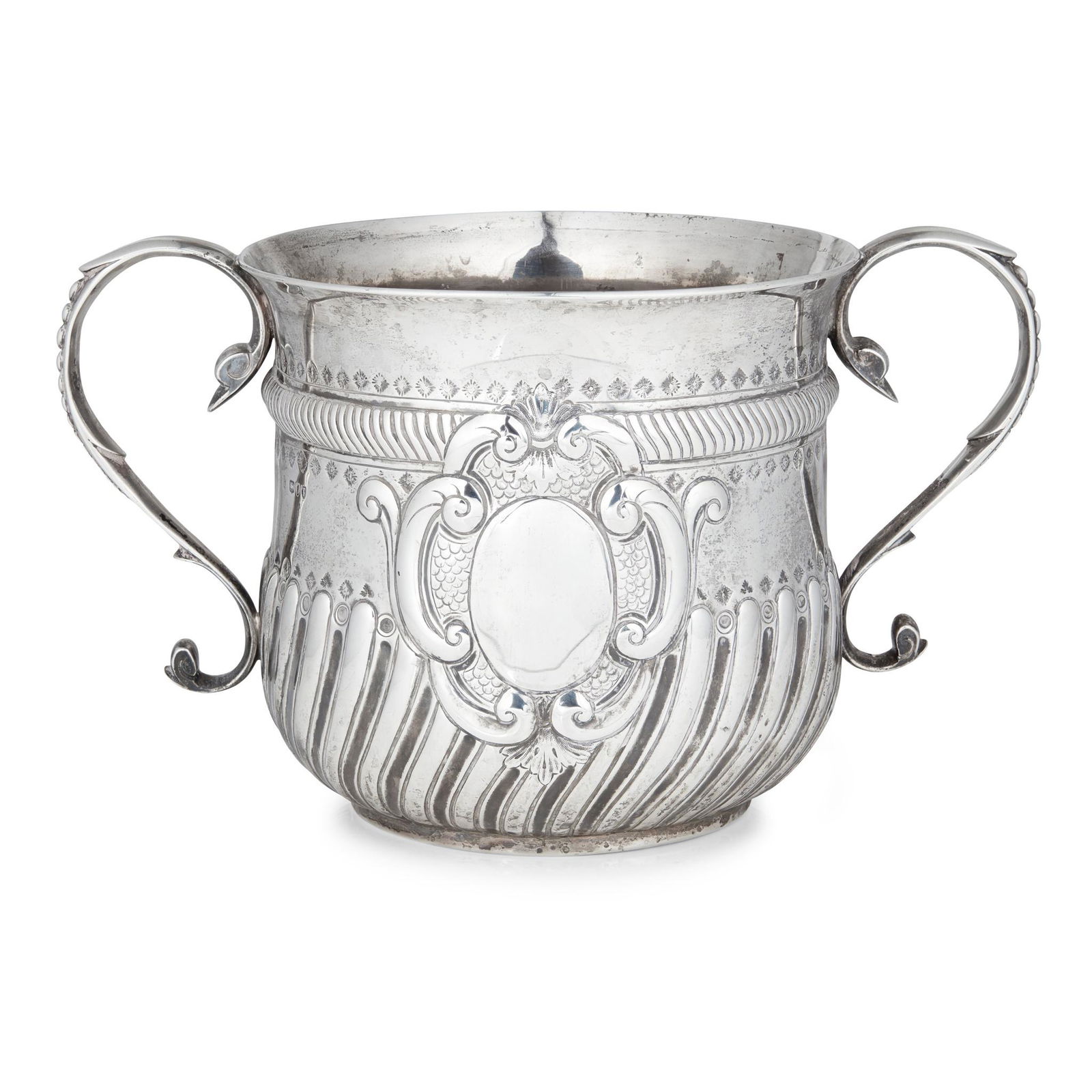 A late Victorian twin-handled porringer: A late Victorian twin-handled porringer Charles Stuart Harris, London 1894, the deep demi-fluted bowl of baluster form with an everted rim, chased borders to the body with a vacant oval cartouche in a