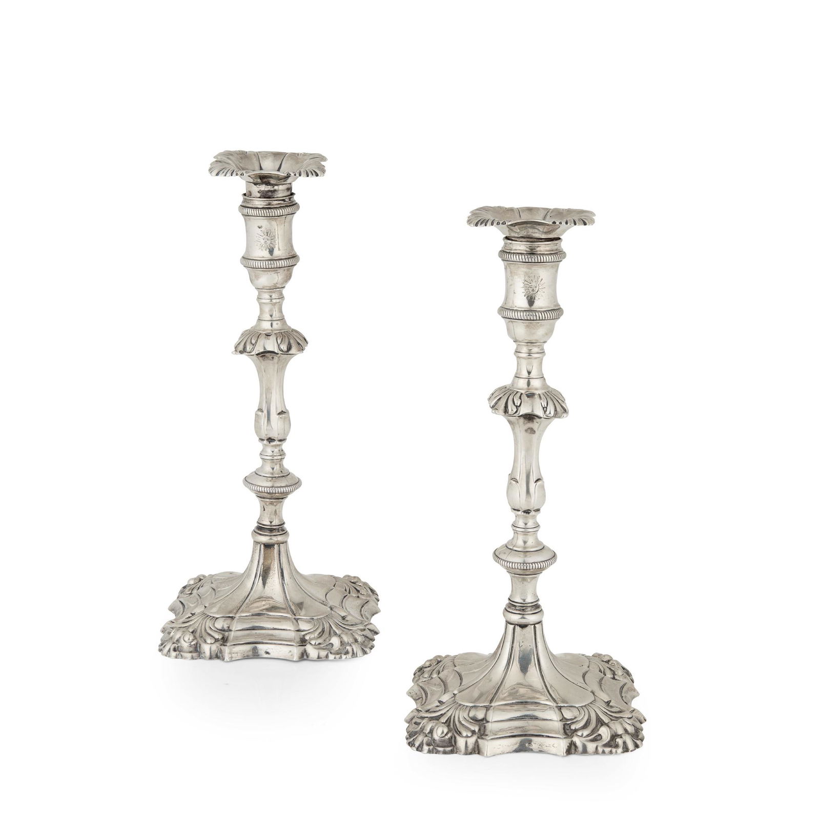 A pair of George III cast table candlesticks (1 of 2)