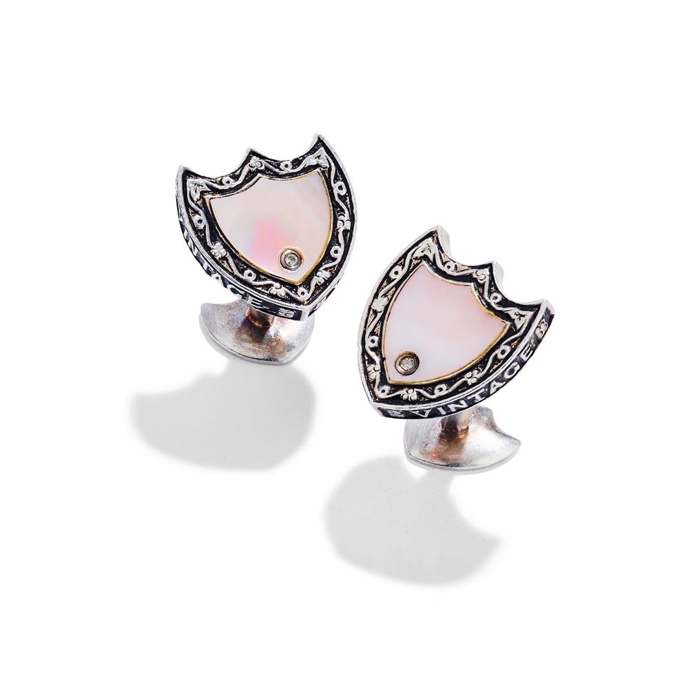 Stephen Webster: A pair of limited edition gem-set silver cufflinks: Stephen Webster: A pair of limited edition gem-set silver cufflinks Each designed as a silver 'Dom Perignon' label with central mother-of-pearl panel accented with a single brilliant-cut diamond, the