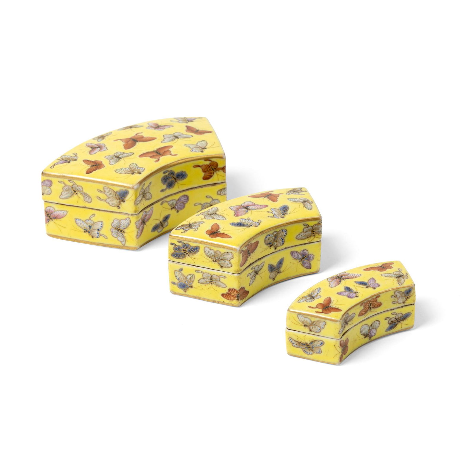 SET OF THREE YELLOW-GROUND FAMILLE ROSE 'BUTTERFLIES' FAN-SHAPED STACKING BOXES AND COVERS QING (1 of 3)