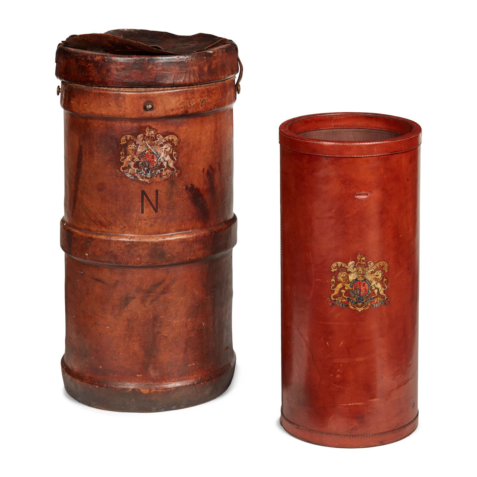 TWO LARGE LEATHER SHELL CASES EARLY 20TH CENTURY: the larger with a Royal Coat of Arms over an embossed N, the cover embossed No. 76 and B.H.&G Ltd. II-1941; the other with a Royal Coat of arms and converted to a stick stand(75cm and 62cm high)Qty: (